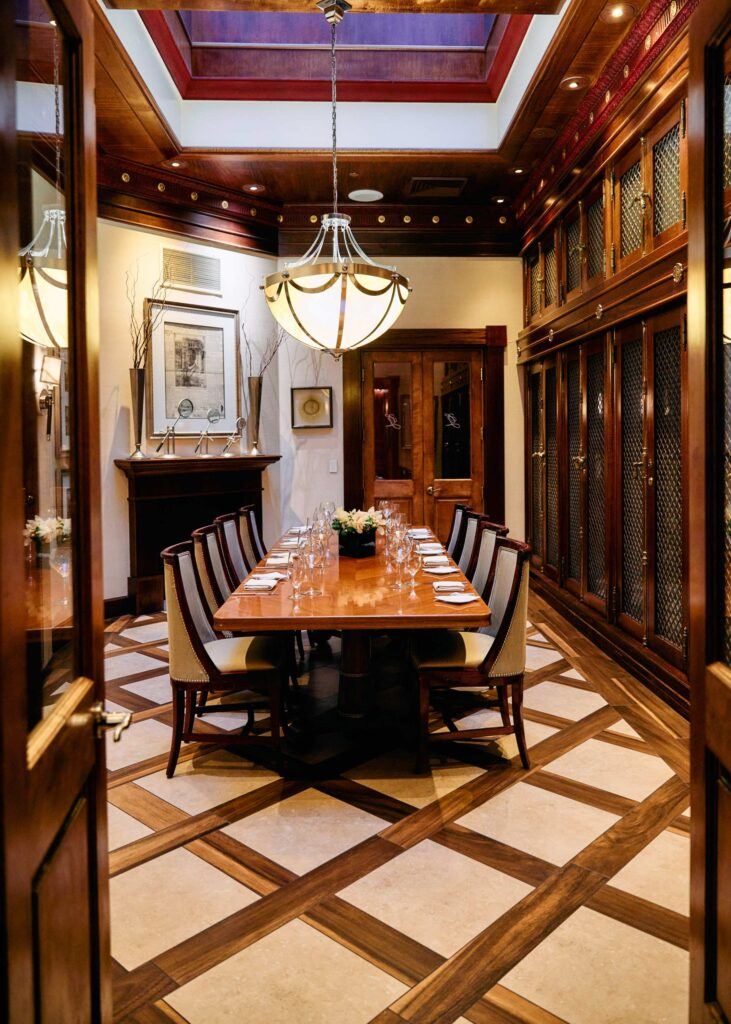 private dining area with table for 8 set unser a chandelier