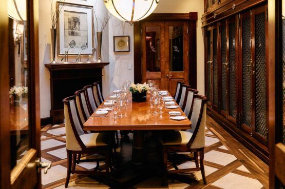 private dining area with table for 8 set unser a chandelier